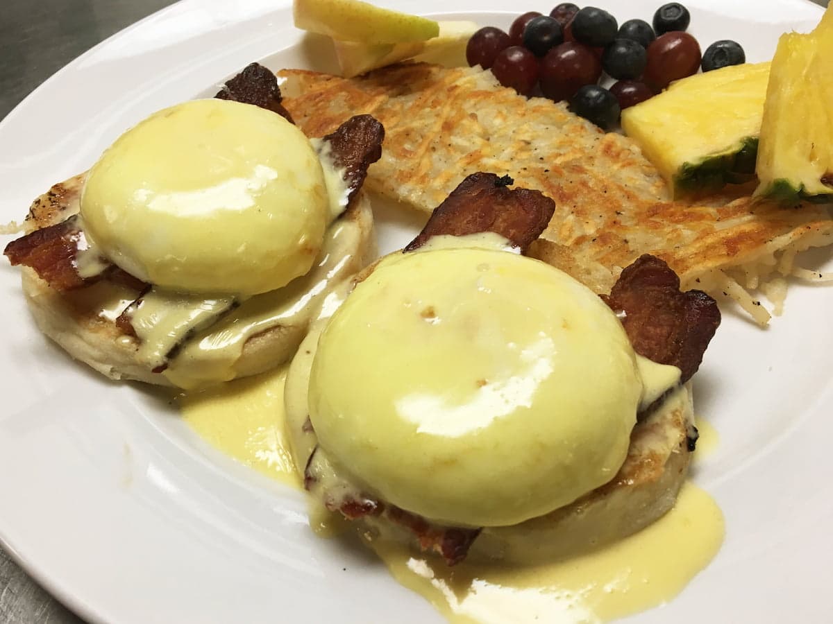 Blackstone eggs benedict with bacon and tomato at Bailey’s Breakfast & Lunch in Omaha