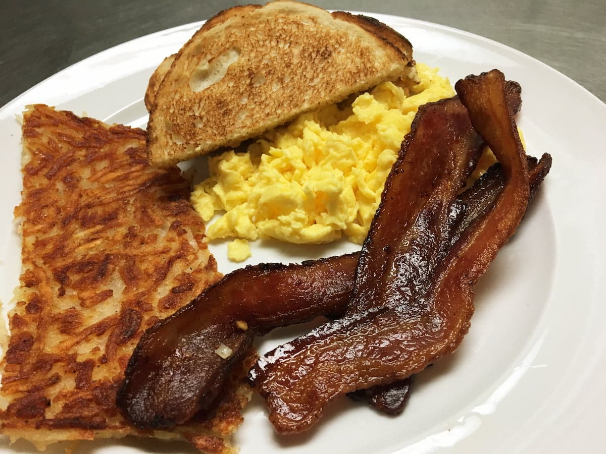 The Classic breakfast plate with eggs and bacon at Bailey’s Breakfast & Lunch in Omaha