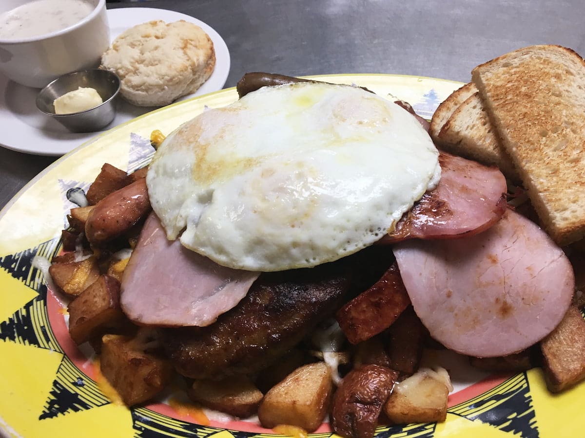 The Porkasaurus breakfast challenge plate with seven house-smoked pork meats at Bailey’s Breakfast & Lunch in Omaha