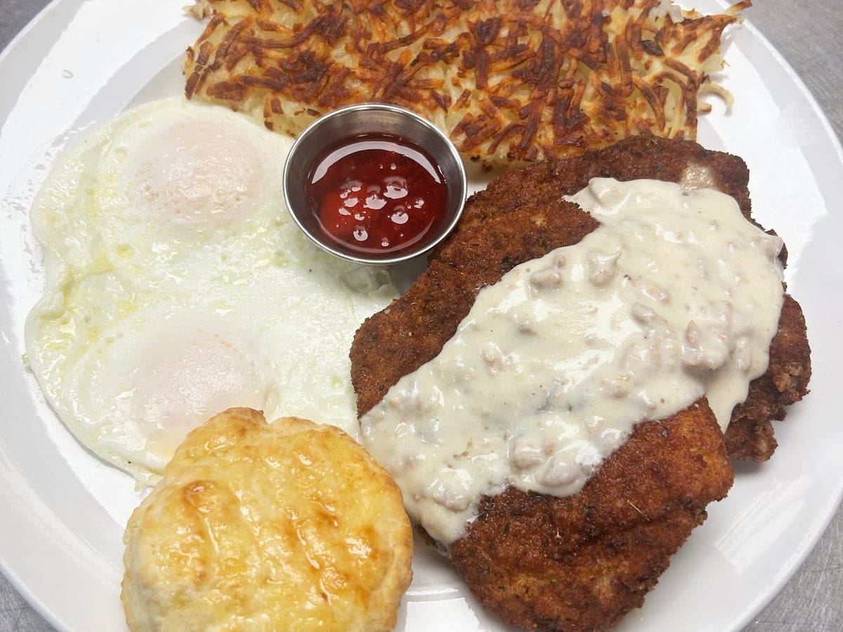 Porkchop breakfast with eggs and hash browns at Bailey’s Breakfast & Lunch in Omaha