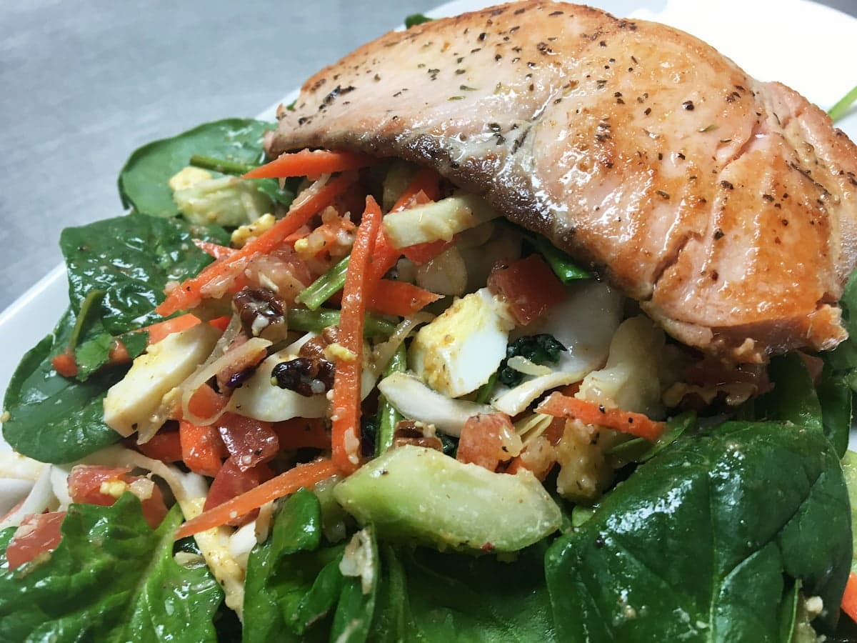Seared salmon salad with mixed greens at Bailey’s Breakfast & Lunch in Omaha