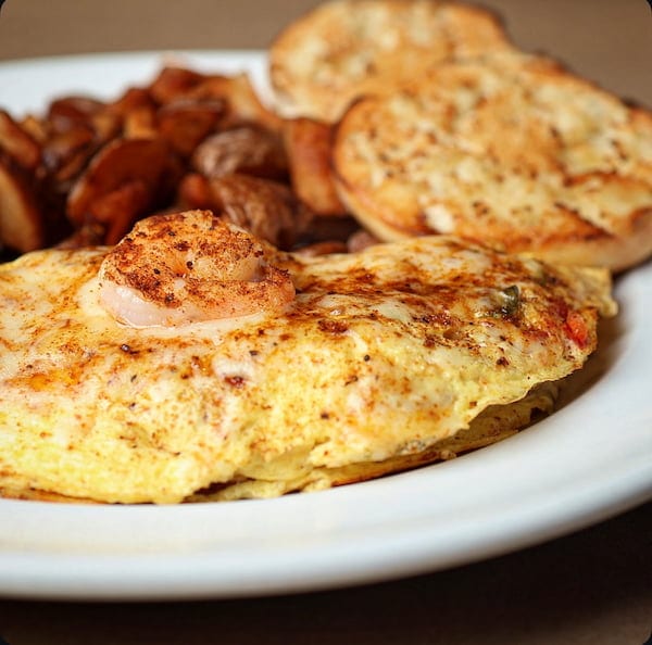 Louisiana omelet breakfast plate with shrimp and andouille sausage at Bailey’s Breakfast & Lunch in Omaha